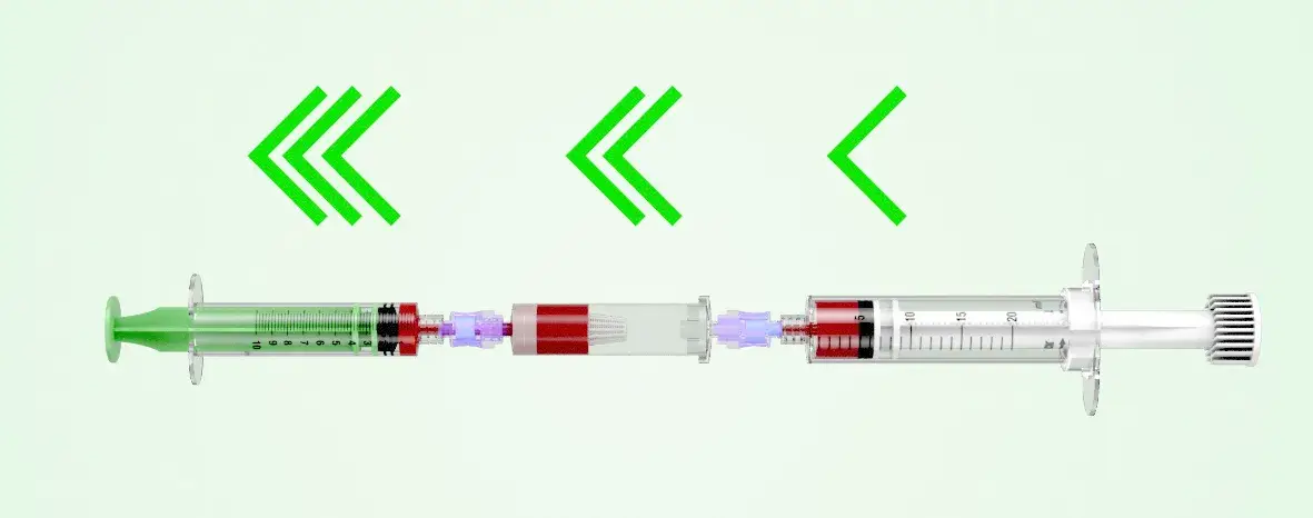 A syringe with a green tip positioned on a black background, highlighting its design and color contrast.